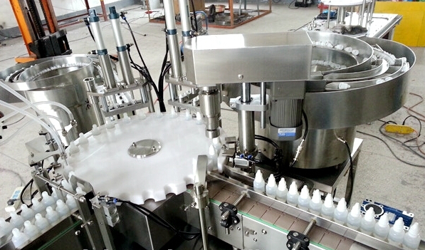 four nozzles filling capping line.jpg