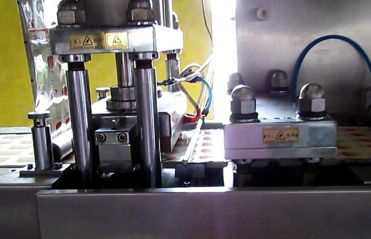 honey making machine filling sealing cups.jpg