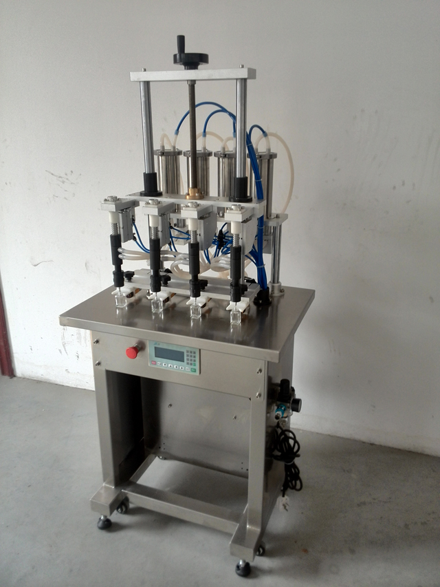 vertical filling machine with 4 heads.jpg